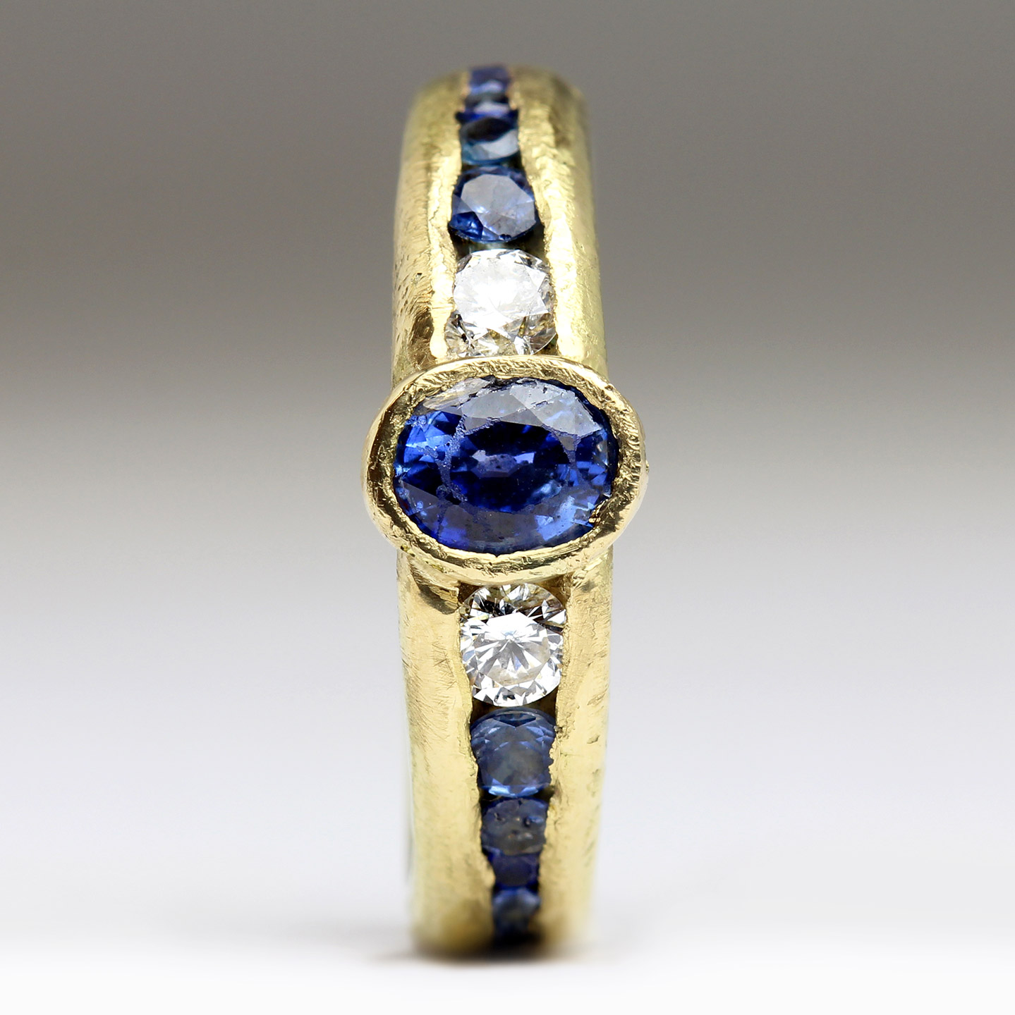 18ct Yellow Gold Sandcast Ring with Oval Sapphire & Tapered Channel of ...